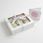 Pastel birthday cookies in windowed gift box with matching bow and card